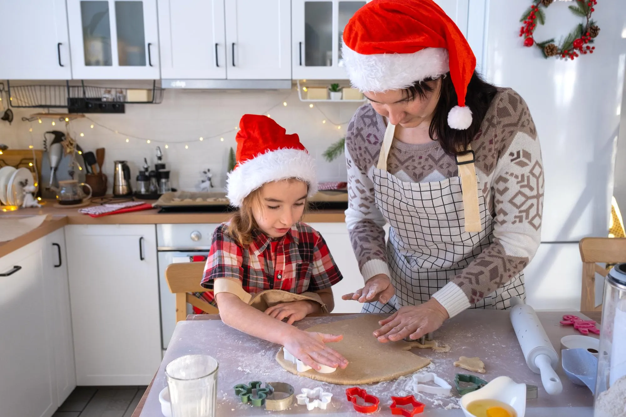 Family helping mother by sharing responsibilities to reduce holiday stress.